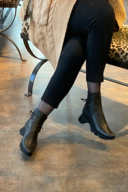 Satin black women's ankle boots with laces at the back.. Worn view - Florence KOOIJMAN